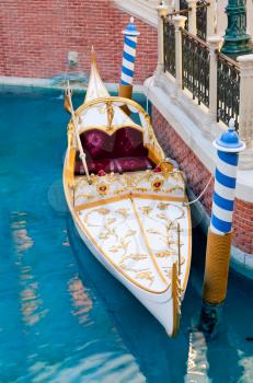 White venetian gondola in Las Vegas casino, USA on blue water
