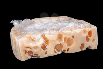 Packed cheese slice isolated on black background
