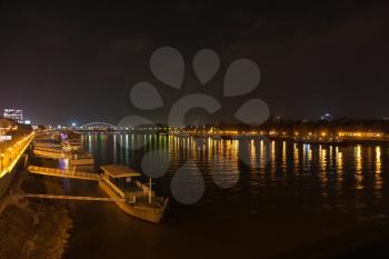 Barge and night lights on the Dunai in Bratislava, Slovakia
