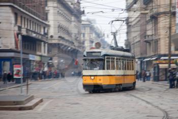 Vintage tram on the city street with motion blur, Milano, Italy
