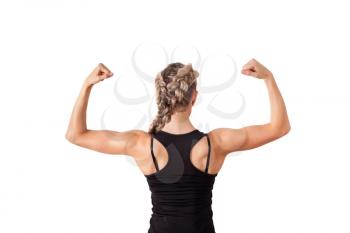 Athletic young woman showing biceps isolated on white
