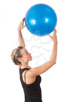 Athletic young woman with blue ball isolated on white
