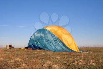 Blown balloon after flight on the ground
