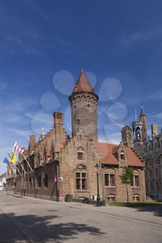 Tower and old houses in Bruges, Belgium
