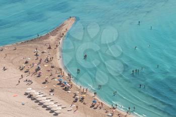 People crowd on the beach, top view, Spain