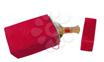 Bottle in the red velour box isolated on white background