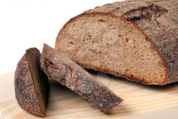 Cut bread on wooden board