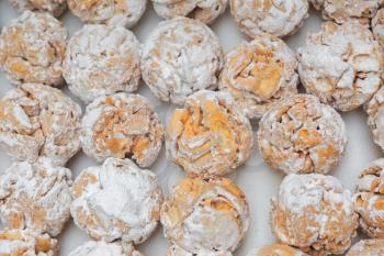 Rothenburg schneeballen (snowball) pastry with sugar powder on the table
