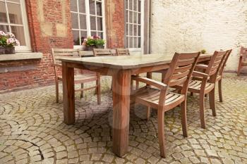 Table and chairs in patio, vintage style
