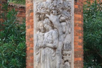 Statues on the brick column in the garden, Venice, Italy
