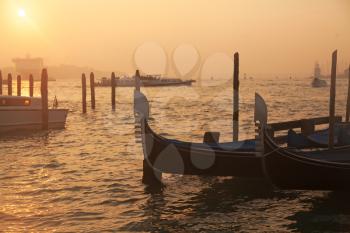 Venetian gondolas at sunrise in Venice, Italy
