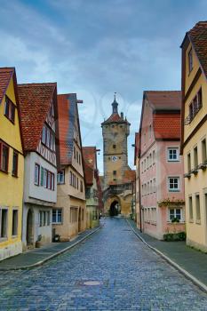 Narrow medieval street with hdr toning in Rothenburg, Germany
