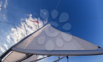 Rigging, ropes, shrouds and sail crop on the yacht
