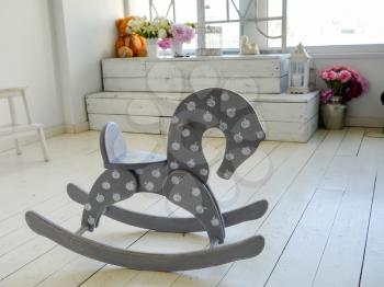 wooden horse on the floor in vintage interior
