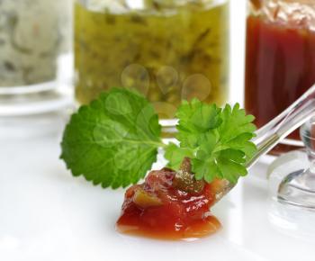 Royalty Free Photo of Salsa and Dips Assortment in Glass Jars