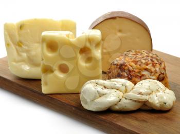 Royalty Free Photo of Cheese on a Wooden Board