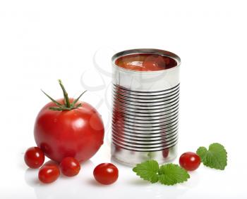 Royalty Free Photo of a Can of Tomato Soup and Tomatoes
