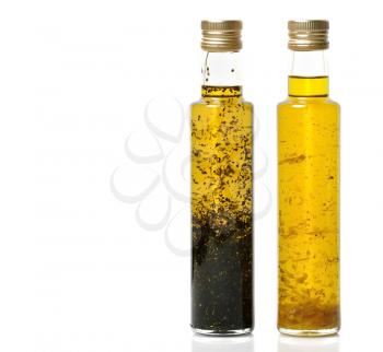 Royalty Free Photo of Bottles Of Garlic And Basil Olive Oil
