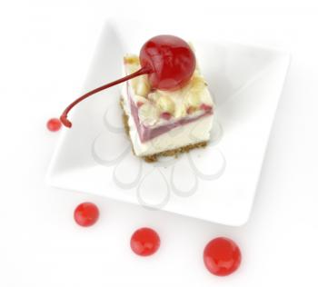 Royalty Free Photo of a Slice of Cherry Cheesecake