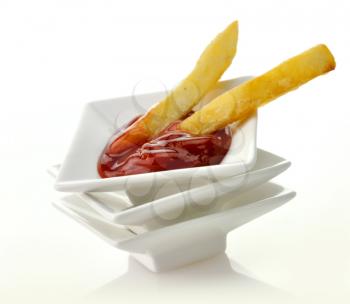 Royalty Free Photo of French Fries in Ketchup