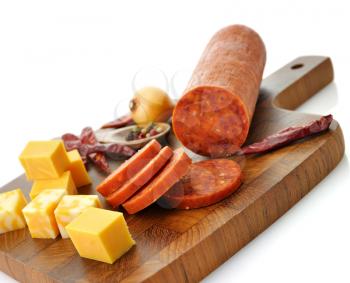 Royalty Free Photo of Meat and Cheese on a Cutting Board