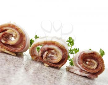 Royalty Free Photo of Sliced Raw Bacon Rolls