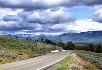 Royalty Free Photo of a Beautiful Mountain Landscape with Dramatic Sky And Road