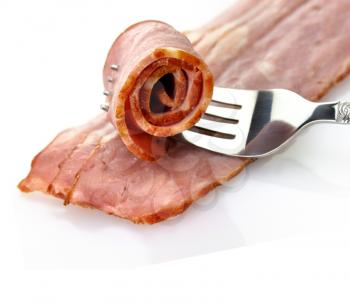 turkey bacon with fork close up 