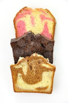 assortment of loaf cake slices , double chocolate ,raspberry swirl and cinnamon swirl.
