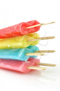 colorful ice cream pops on a white background, close up