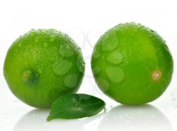 Limes with leaf on a white background