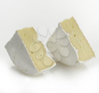 Wedges Of French Brie Cheese On White Background 