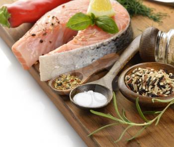 Wild Rice And Salmon With Spices On A Wooden Board