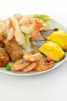 assortment of seafood on a white plate