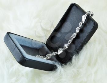 a crystal silver  bracelet in a black box