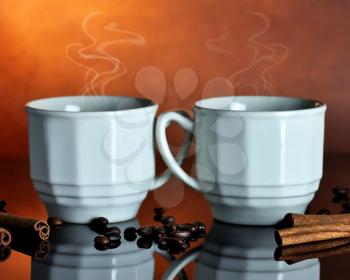 two cups of hot coffee 
