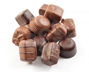a stack of chocolate candies on white background