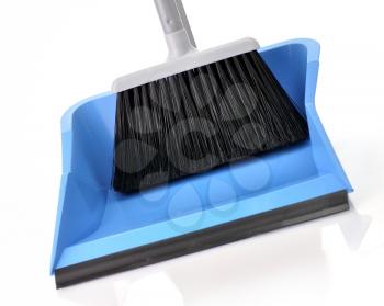 plastic broom with dustpan , close up on white background
