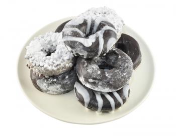 assortment of donuts on a plate , close up shot