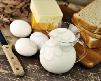 dairy products and Fresh eggs on a old wooden table