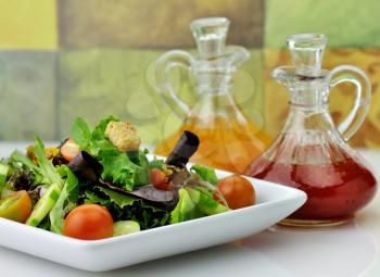 fresh vegetable salad with salad dressings