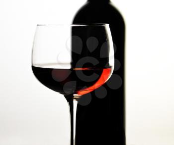 red wine glass and bottle  , close up