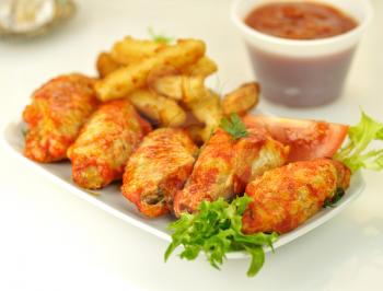 hot chicken wings with fried potatoes 