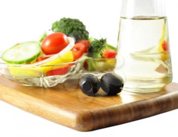 a fresh vegetable salad and cooking oil