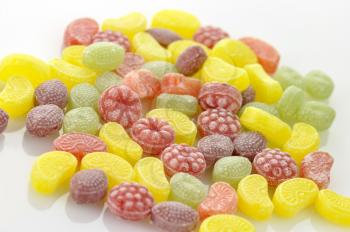 colorful fruit flavored candies assortment on a white background