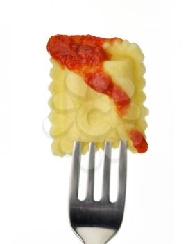 cooked ravioli with tomato sauce on a fork 