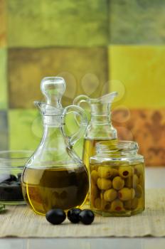  bottles of olive oil with olives