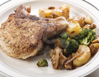 pork chops with potatoes broccoli and onions