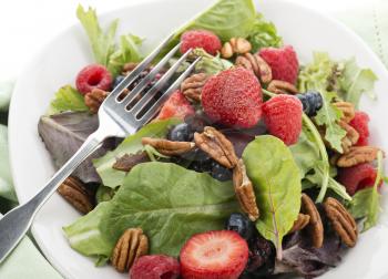 Fresh Spring Salad leaves With Berries And Peanuts,Close Up