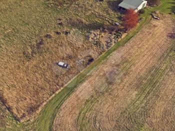 Bird view of  old abandoned and rusty vehicles in the autumn field